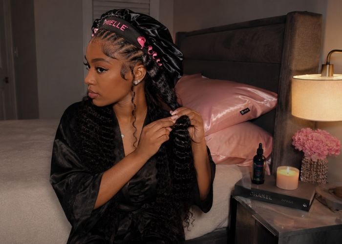 Nighttime hair care routine to prevent tangling, including brushing, moisturizing, protective braiding, and satin bonnet for healthy hair overnight.