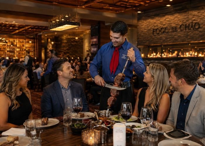 Guests dining in business casual attire at Fogo de Chão Brazilian Steakhouse